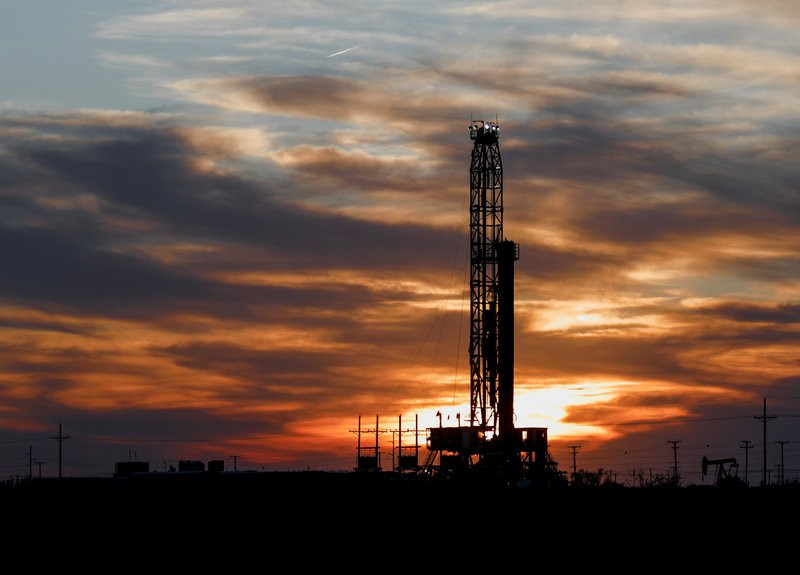 An oil rig stands against the setting sun in Midland, Texas on Friday, April 17, 2020.