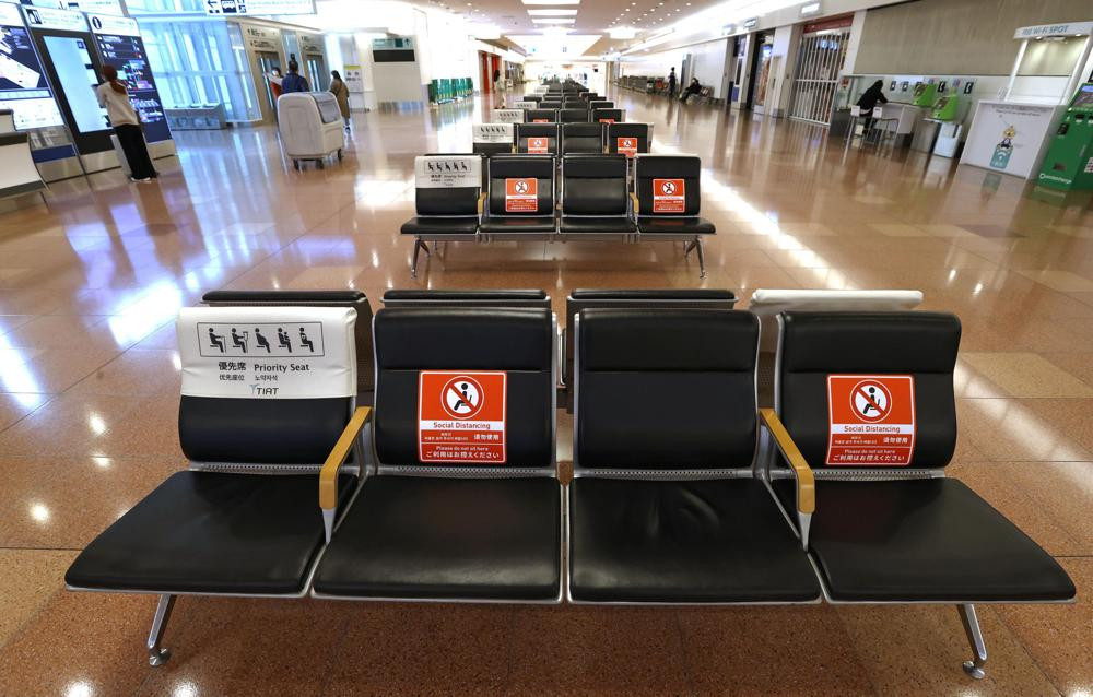 The arrival lobby of the international terminal is deserted at Haneda Airport in Tokyo, Japan, Tuesday, Nov. 30, 2021.