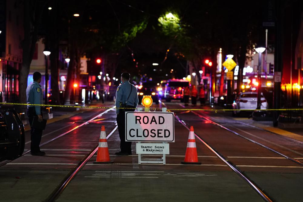 A roadblock is set a block away from the scene of an apparent mass shooting in Sacramento, Calif., Sunday, April 3, 2022.