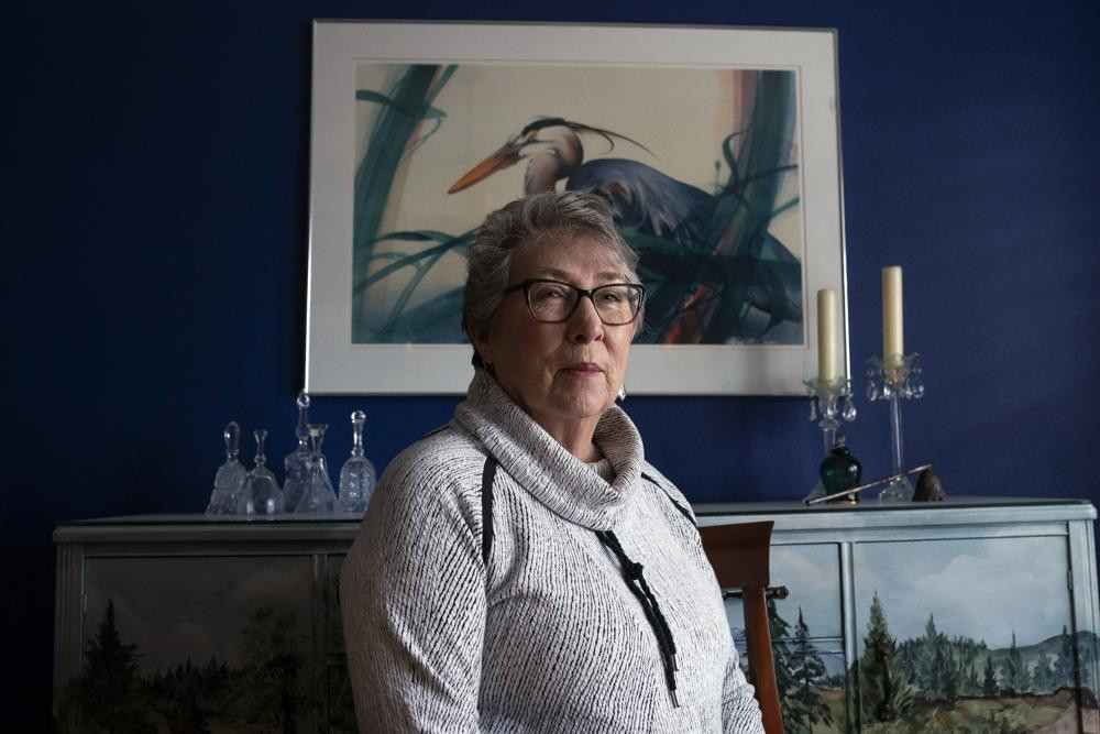 Joyce Ares sits for a portrait in the dinning room of her home on Friday, March 18, 2022, in Canby, Ore.