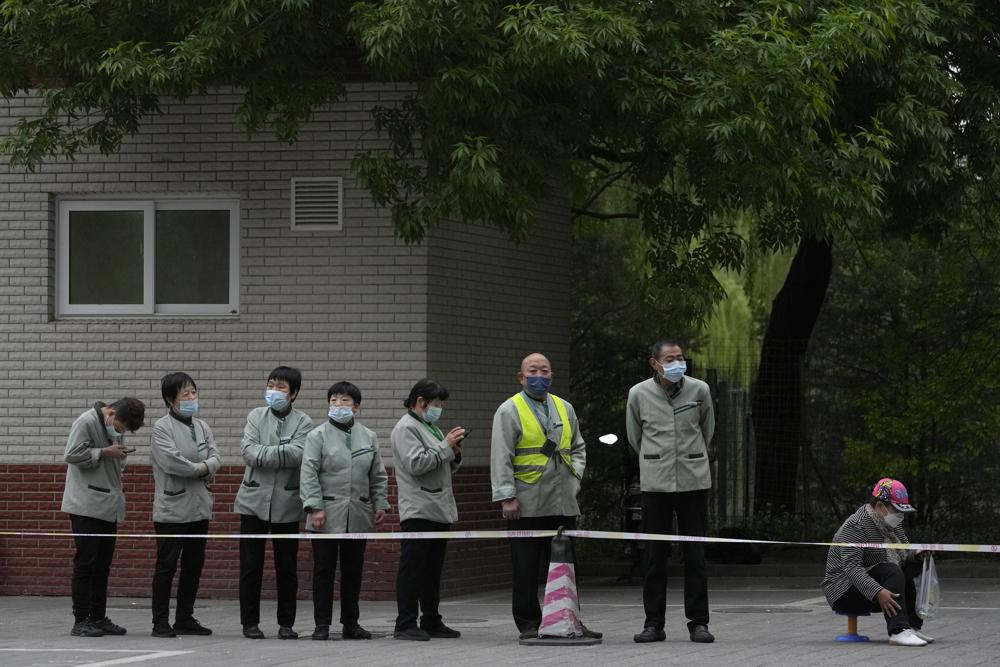 Residents line up for COVID test, Wednesday, April 27, 2022, in Beijing.