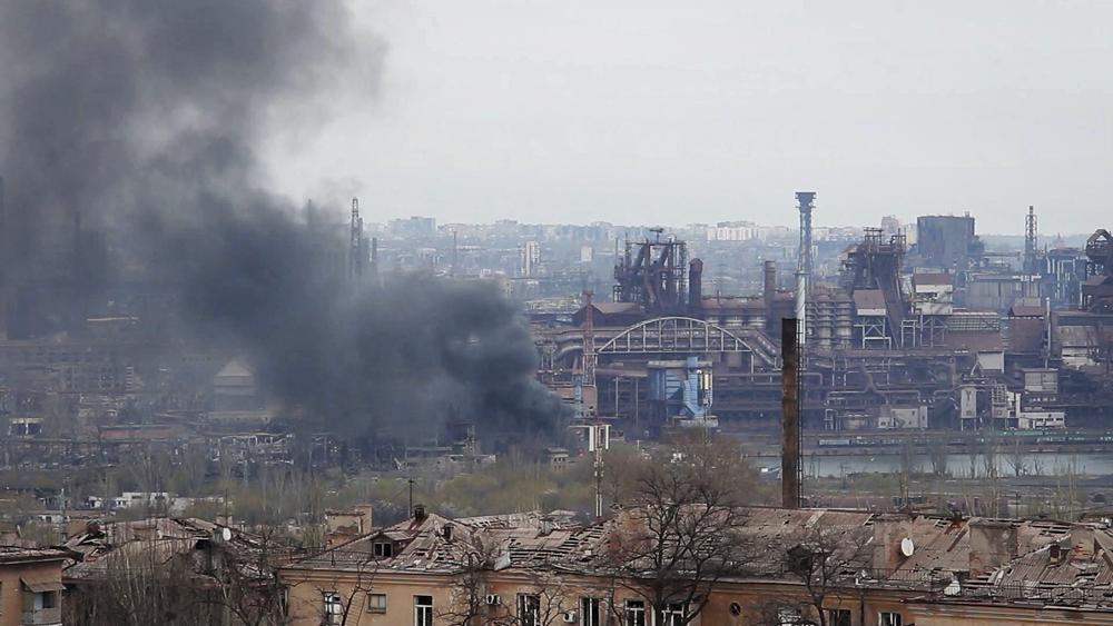In this photo taken from video smoke rises from the Metallurgical Combine Azovstal in Mariupol, in territory under the government of the Donetsk People's Republic, eastern Ukraine, Tuesday, May 3, 2022.