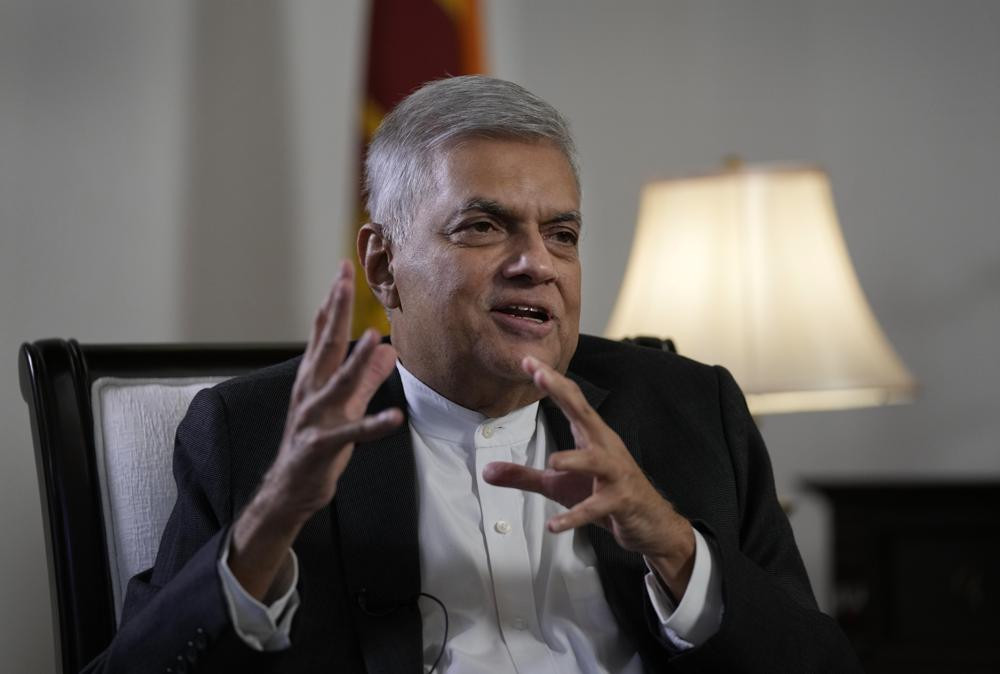 Sri Lanka's new prime minister Ranil Wickremesinghe gestures during an interview with The Associated Press in Colombo, Sri Lanka, Saturday, June 11, 2022.