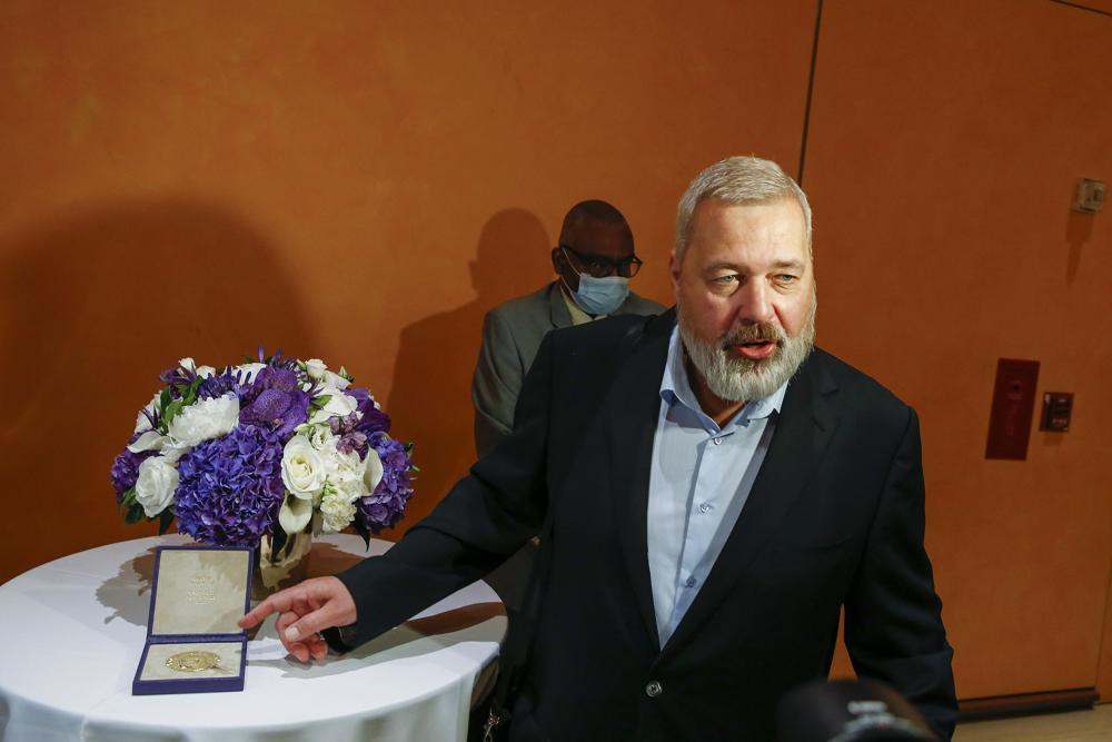 Nobel Peace Prize winner Dmitry Muratov, editor-in-chief of the influential Russian newspaper Novaya Gazeta, poses for a picture next to his 23-karat gold medal before it is auctioned at the Times Center, Monday, June 20, 2022, in New York. AP/RSS Photo