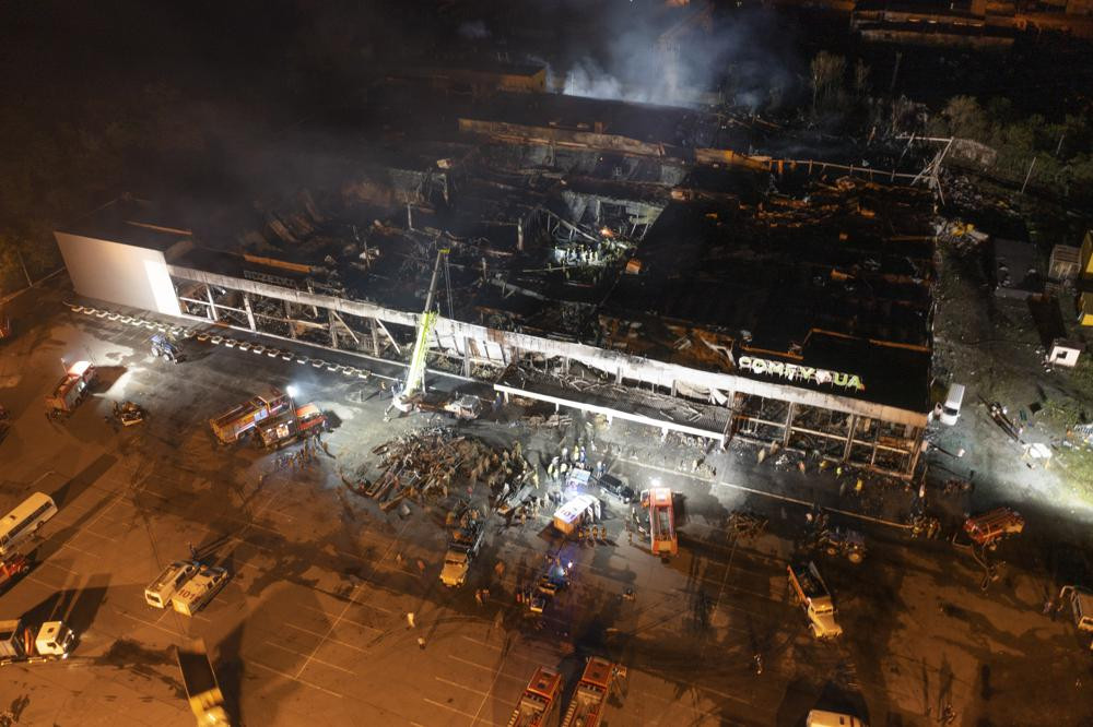 Ukrainian State Emergency Service firefighters work to extinguish a fire at a shopping center burned after a rocket attack in Kremenchuk, Ukraine, late Monday, June 27, 2022.  AP/RSS Photo