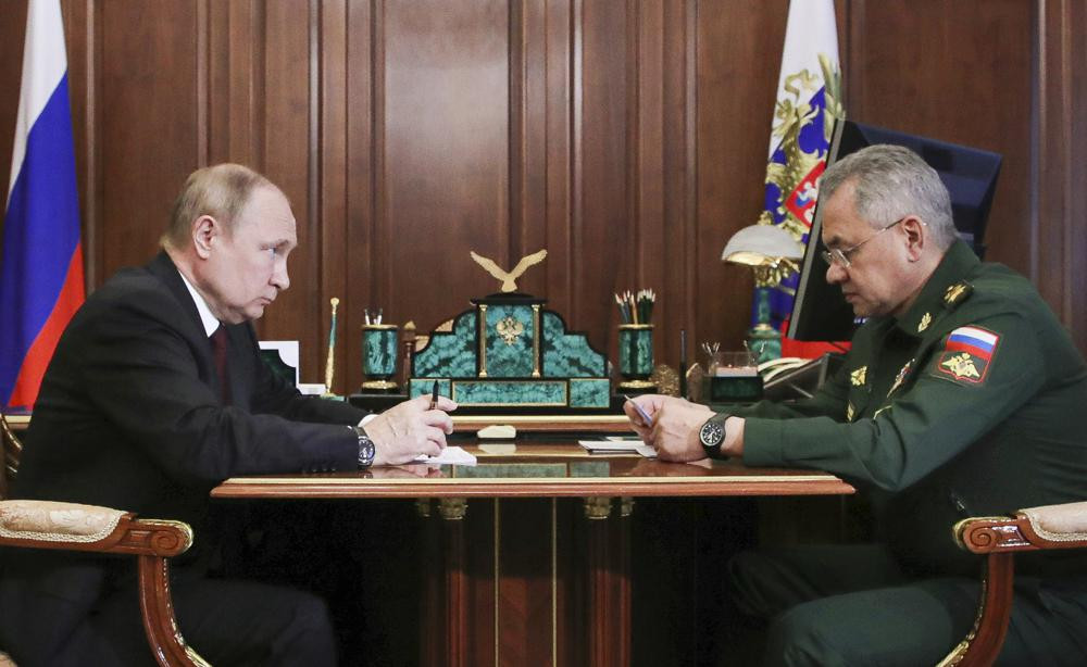 FILE - Russian President Vladimir Putin, left, listens to Russian Defense Minister Sergei Shoigu's report during their meeting in the Kremlin in Moscow, Russia, Monday, July 4, 2022. AP/RSS Photo