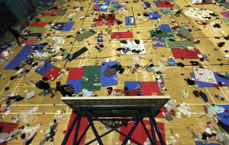 Protesters walk in a gymnasium on the campus of the Polytechnic University in Hong Kong, Wednesday, Nov. 20, 2019.