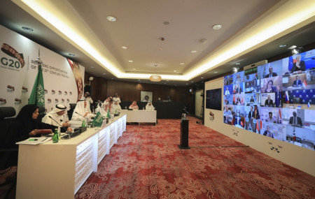 In this photo released by Saudi Energy Ministry, Prince Abdulaziz bin Salman Al-Saud, Minister of Energy of Saudi Arabia, third right, chairs a virtual summit of the Group of 20 energy ministers at his office in Riyadh, Saudi Arabia, Friday.