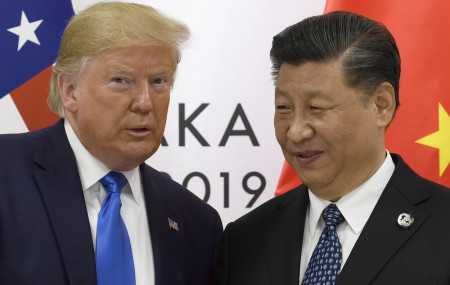In this June 29, 2019, file photo, U.S. President Donald Trump poses for a photo with Chinese President Xi Jinping during a meeting on the sidelines of the G-20 summit in Osaka, western Japan.