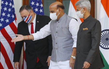 Indian Defence Minister Rajnath Singh, center, gestures towards U.S. Secretary of State Mike Pompeo, left, with Indian Foreign Minister Subrahmanyam Jaishankar, right, standing beside him, ahead of their meeting at Hyderabad House in New Delhi, India.