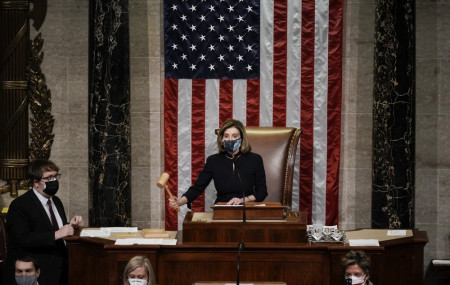 Speaker of the House Nancy Pelosi, D-Calif., leads the final vote of the impeachment of President Donald Trump, for his role in inciting an angry mob to storm the Congress last week, at the Capitol in Washington, Wednesday.