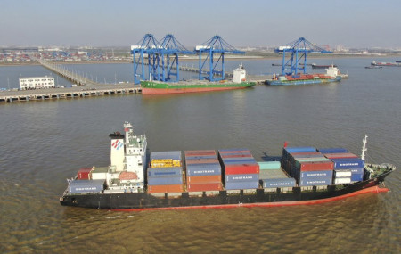 A container ship leaves a port in Nantong in eastern China's Jiangsu Province, Dec. 20, 2020.