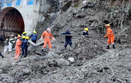This photograph provided by National Disaster Response Force shows NDRF personnel prepare to rescue workers at one of the hydropower project at Reni village in Chamoli district of Indian state of Uttrakhund, Monday, Feb. 8, 2021.
