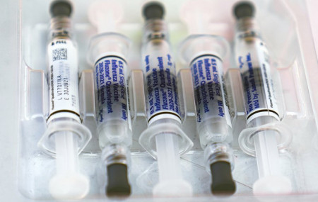 This Saturday, Oct. 17, 2020 file photo shows influenza vaccine syringes at the L.A. Care Health Plan and Blue Shield of California Promise Health Plan's Community Resource Center's Free Drive-Thru vaccination event in Los Angeles.