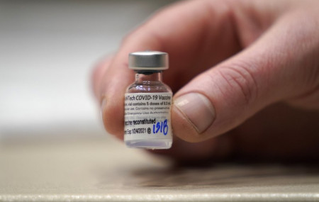 In this Jan. 24, 2021, file photo, a vial of the Pfizer vaccine for COVID-19 is shown at a one-day vaccination clinic set up in an Amazon.com facility in Seattle and operated by Virginia Mason Franciscan Health.