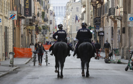 Mounted police officers patrol Via del Corso main shopping street, in downtown Rome, Saturday, April 3, 2021. Italy went into lockdown on Easter weekend in its effort to battle then Covid-19 pandemic.