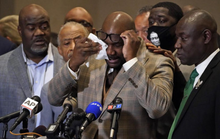 George Floyd's brother Philonise Floyd wipes his eyes during a news conference, Tuesday, April 20, 2021, in Minneapolis, after the verdict was read in the trial of former Minneapolis Police officer Derek Chauvin.