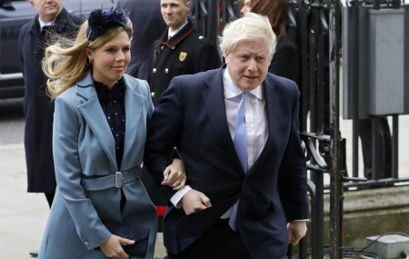In this Monday, March 9, 2020, file photo Britain's Prime Minister Boris Johnson and his partner Carrie Symonds arrive to attend the annual Commonwealth Day service at Westminster Abbey in London.