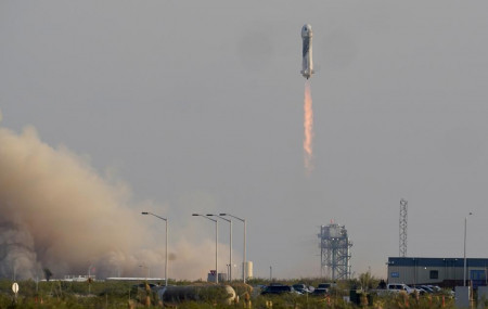 Blue Origin's New Shepard rocket launches carrying passengers Jeff Bezos, founder of Amazon and space tourism company Blue Origin, brother Mark Bezos, Oliver Daemen and Wally Funk, from its spaceport near Van Horn, Texas, Tuesday.