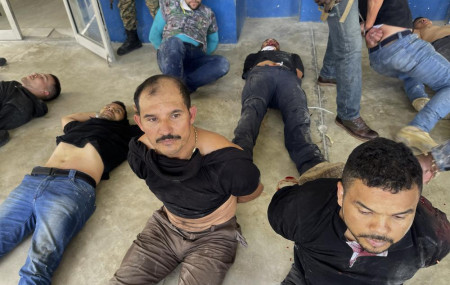 In this July 8, 2021 file photo, suspects in the assassination of Haiti's President Jovenel Moise are shown to the media at police headquarters in Port-au-Prince, Haiti.