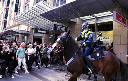 Protesters and mounted police clash at Sydney Town Hall during a 'World Wide Rally For Freedom' anti-lockdown rally in Sydney, Saturday, July 24, 2021.