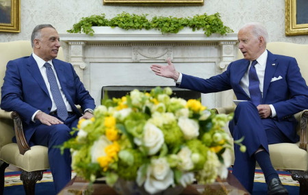 US President Joe Biden, right, speaks as Iraqi Prime Minister Mustafa al-Kadhimi, left, listens during their meeting in the Oval Office of the White House in Washington, Monday, July 26, 2021.