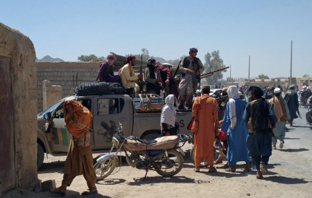 Taliban fighters patrol inside the city of Farah, capital of Farah province, southwest Afghanistan, Wednesday, Aug. 11, 2021.