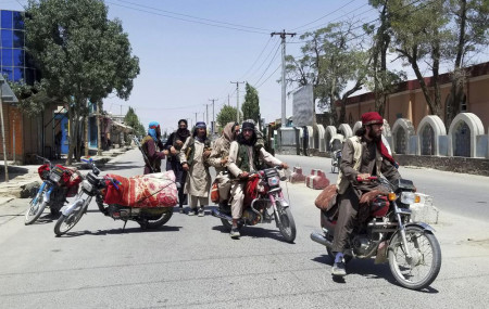 Taliban fighters patrol inside the city of Ghazni, southwest of Kabul, Afghanistan, Thursday, Aug. 12, 2021.
