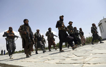 In this Aug. 19, 2021, file photo, Taliban fighters patrol in Kabul, Afghanistan.
