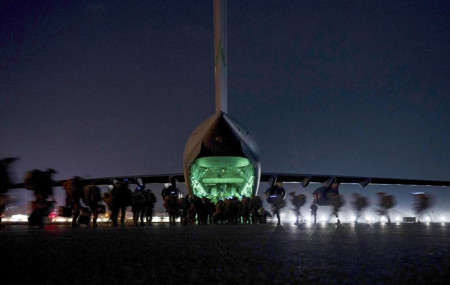 In this Aug. 30, 2021, file photo provided by the U.S. Air Force, soldiers, assigned to the 82nd Airborne Division, prepare to board a U.S. Air Force C-17 Globemaster III aircraft at Hamid Karzai International Airport in Kabul, Afghanistan.