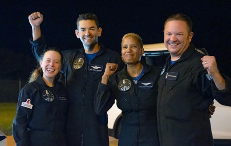 In this image released by Inspiration4, passengers aboard a SpaceX capsule, from left to right, Hayley Arceneaux, Jared Isaacman, Sian Proctor and Chris Sembroski pose after the capsule was recovered following its splashdown in the Atlantic.