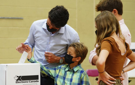 Liberal leader Justin Trudeau casts his ballot in the 44th general federal election as he's joined by his children, Xavier, Ella-Grace and Hadrien in Montreal on Monday, Sept. 20, 2021.