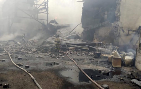 Emergency personnel work at the site of an explosion and fire at a gunpowder factory in the Ryazan region, about 270 kilometers (about 167 miles) southeast of Moscow, Russia, Friday, Oct. 22, 2021.