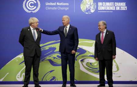 British Prime Minister Boris Johnson, left, and UN Secretary-General Antonio Guterres, right, greet U.S. President Joe Biden , at the COP26 U.N. Climate Summit in Glasgow, Scotland, Monday, Nov. 1, 2021.