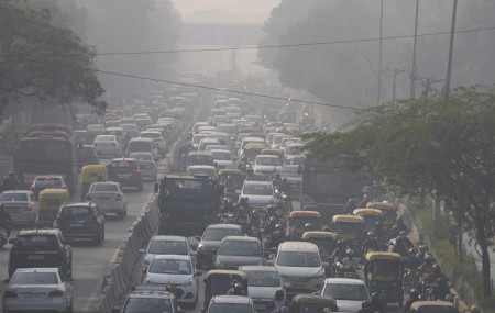 Commuters drive amidst morning haze and toxic smog in New Delhi, India, Wednesday, Nov. 17, 2021.
