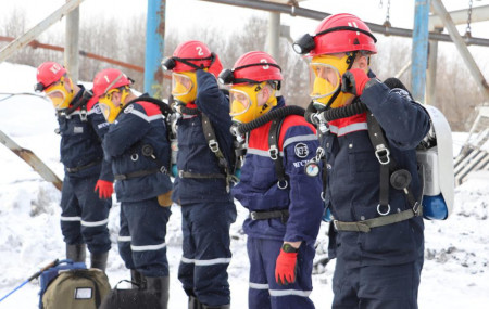 In this Russian Emergency Situations Ministry Thursday, Nov. 25, 2021 photo, rescuers prepare to work at a fire scene at a coal mine near the Siberian city of Kemerovo, about 3,000 kilometres (1,900 miles) east of Moscow, Russia.
