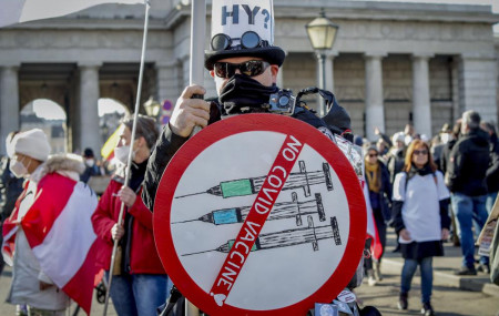 A man takes part in a demonstration against the country's coronavirus restrictions in Vienna, Austria, Saturday, Nov. 20, 2021.