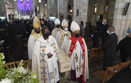 The coffin is carried out of the cathedral at the end of the funeral service for Anglican Archbishop Emeritus Desmond Tutu in St. George's Cathedral in Cape Town, South Africa, Saturday, Jan. 1, 2022.