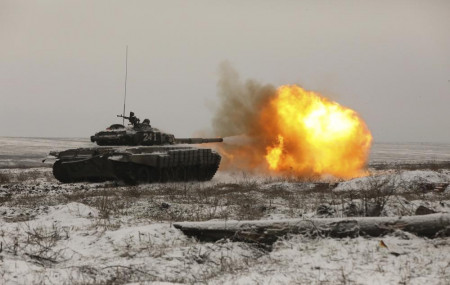 A Russian tank T-72B3 fires as troops take part in drills at the Kadamovskiy firing range in the Rostov region in southern Russia, on Jan. 12, 2022.