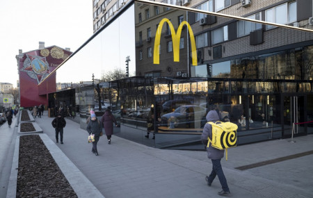 FILE - People walk past a McDonald's restaurant in the main street in Moscow, Russia, Wednesday, March 9, 2022.
