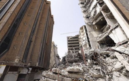 In this photo released by Iran on Friday, May 27, 2022, ruins of a tower at under construction 10-story Metropol Building remains after it collapsed on Monday, in the southwestern city of Abadan, Iran.