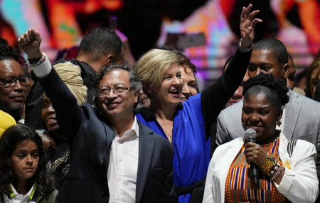 Former rebel Gustavo Petro, left, his wife Veronica Alcocer, back center, and his running mate Francia Marquez, celebrate before supporters after winning a runoff presidential election in Bogota, Colombia, Sunday, June 19, 2022. AP/RSS Photo