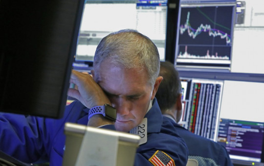 Specialist Timothy Nick works on the floor of the New York Stock Exchange, Monday, March 9, 2020.