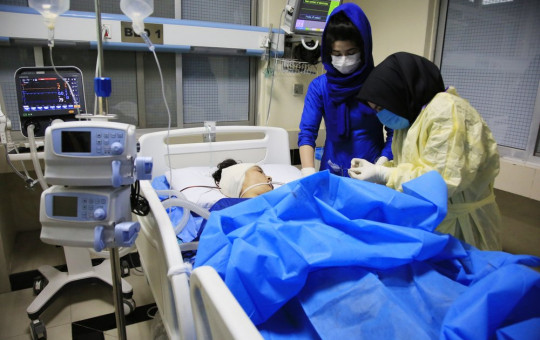 An Afghan receives treatment at hospital after suicide attack in Kabul, Afghanistan, Saturday, Oct. 24, 2020. The death toll from the suicide attack Saturday in Afghanistan's capital has risen that includes schoolchildren, the interior ministry said.