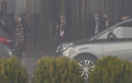 Members of a World Health Organization team leave their hotel on a foggy day for another day of field visit in Wuhan in central China's Hubei province on Wednesday, Feb. 3, 2021.