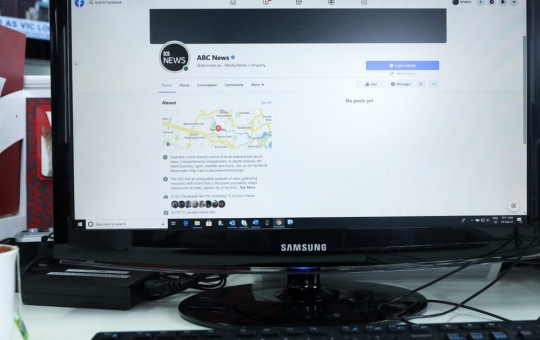 An Australian Broadcasting Corporation page on Facebook is displayed without posts in Sydney, Thursday, Feb. 18, 2021. Facebook is vowing to restrict news sharing as Australian lawmakers consider forcing digital giants into payment agreements.