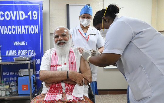 In this photo provided by Prime Minister of India Narendra Modi's twitter handle, Indian Prime Minister Narendra Modi is administered a COVID-19 vaccine in New Delhi, India, Monday, March 1, 2021.