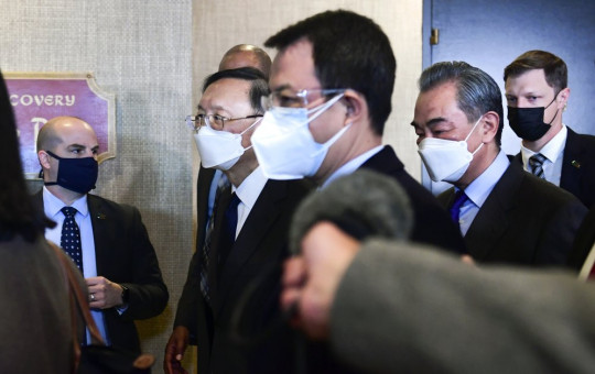 Chinese Communist Party foreign affairs chief Yang Jiechi, second from left, and China's State Councilor Wang Yi, second from right, depart the ballroom from the closed-door morning session of US-China talks in Anchorage, Alaska on Friday, March 19, 2021.