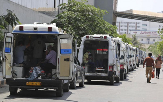 Ambulances carrying COVID-19 patients line up waiting for their turn to be attended at a dedicated COVID-19 government hospital in Ahmedabad, India, Thursday, April 22, 2021.