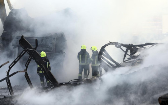 Firefighters work to extinguish burning fuel tankers in Kabul, Afghanistan, Sunday, May 2, 2021.